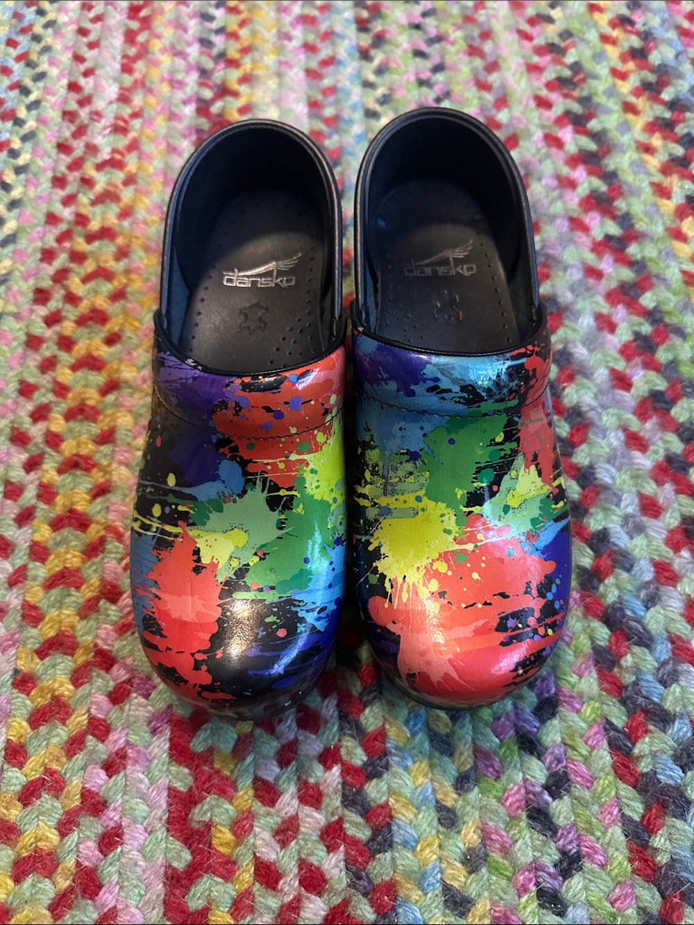 Dansko Multicolor Paint-Splash Clogs — Black Base with Bright Accents